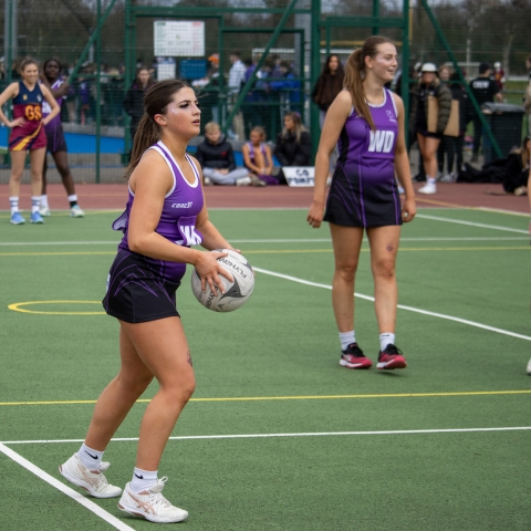 Netball player holding the ball