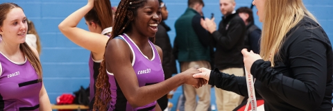 Netball player receiving a winning medal